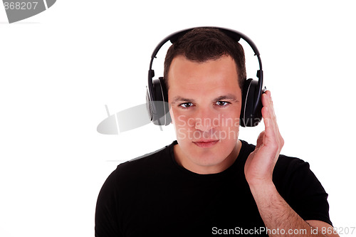 Image of man listening music in headphones