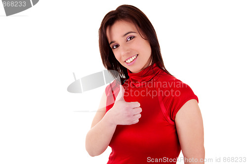 Image of Young pretty women with thumb raised as a sign of success, thumbs up