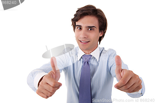 Image of young businessman giving consent, with thumb up