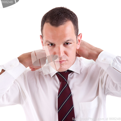 Image of Businessman putting on tie