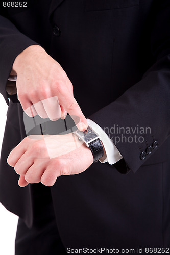 Image of businessman pointing to the watch