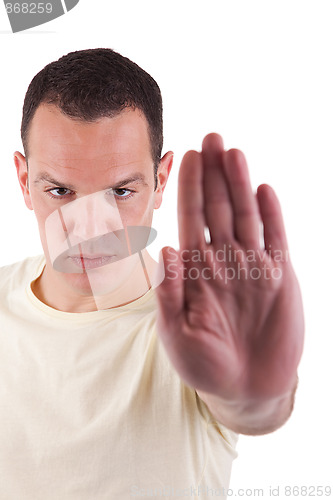 Image of man with his hand raised in signal to stop