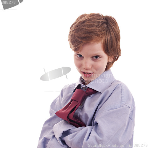 Image of child's shirt and tie, smiling