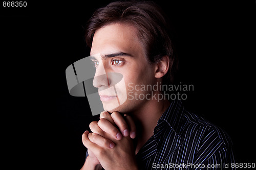 Image of Portrait of a handsome young man thinking