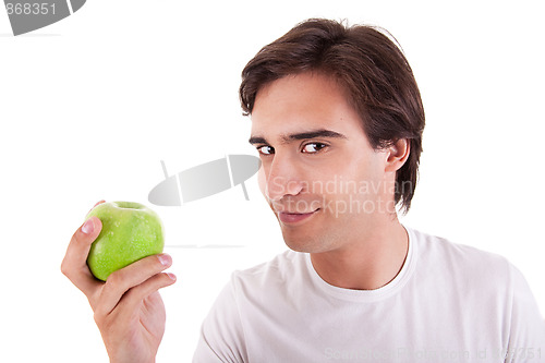 Image of man eating a green apple