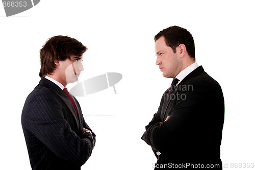 Image of two businessman standing face to face
