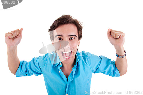 Image of Portrait of a very happy young man with his arms raised