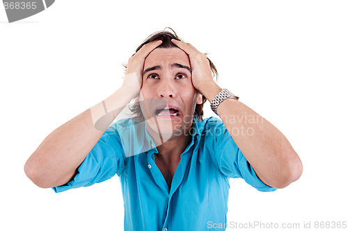 Image of Strongly afflicted young man, with hands on head