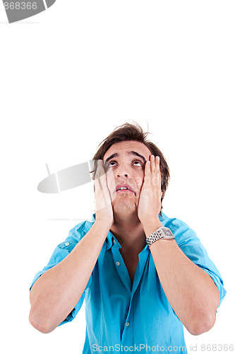 Image of Strongly afflicted young man, with hands on face