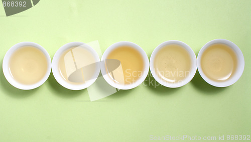 Image of tea in cup in a row