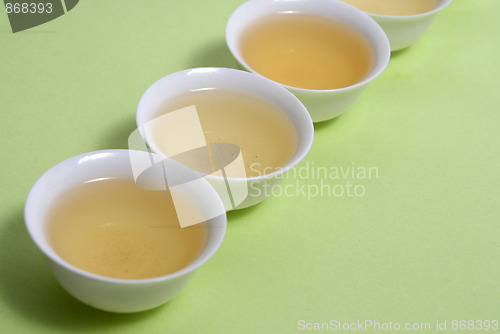 Image of tea in cup in a row