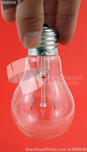 Image of lightbulb isolated on red
