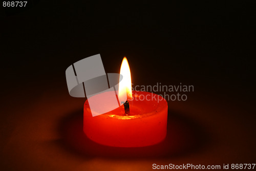 Image of Candles burning in the dark