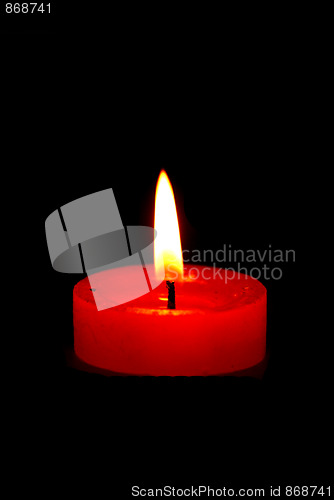 Image of Candles burning in the dark