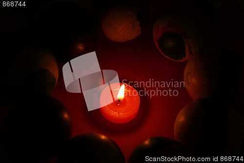 Image of Candles burning in the dark