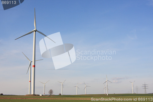 Image of wind turbines under blue sky