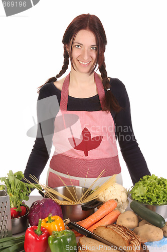 Image of beautiful housewife preparing