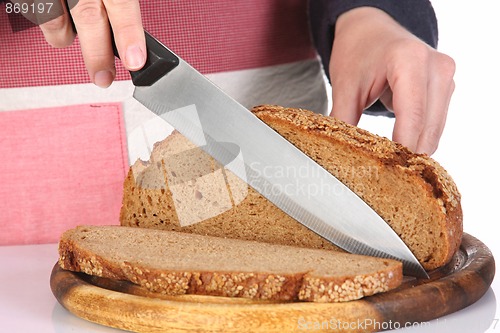 Image of cutting bread with knife