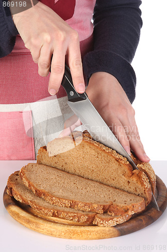 Image of cutting bread with knife