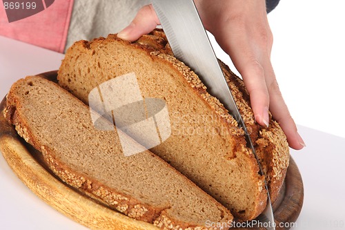 Image of cutting bread with knife