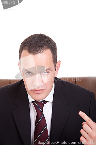 Image of Businessman upset seated on a chair, isolated on white background. Studio shot.