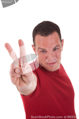 Image of man with arm raised in victory sign, isolated on white background. Studio shot