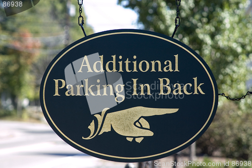 Image of Wooden hand sign pointing to additional parking