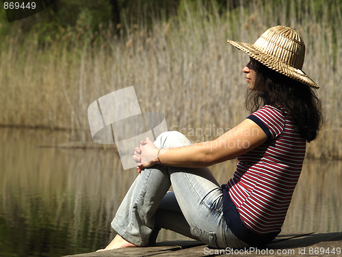 Image of Girl resting near lake