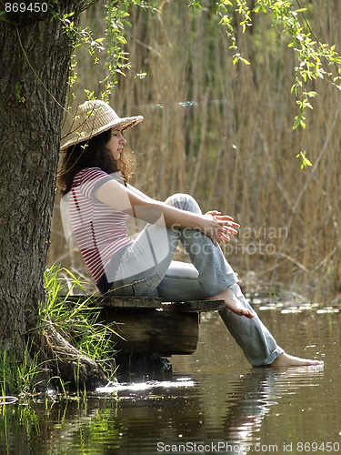 Image of Girl resting near lake