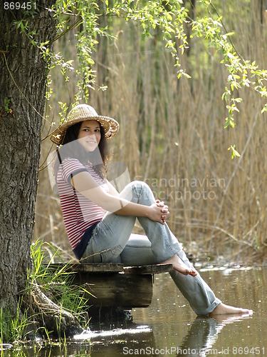 Image of Girl resting near lake