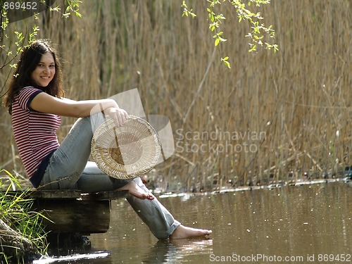 Image of Girl resting near lake