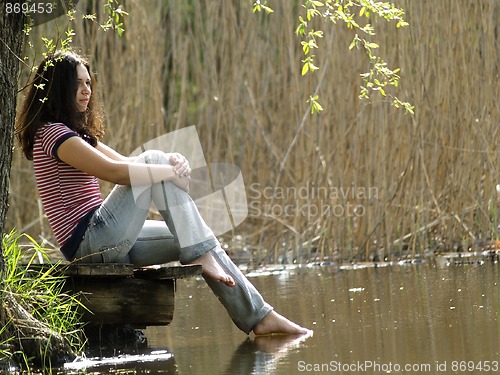 Image of Girl resting near lake