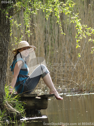 Image of Girl resting near lake