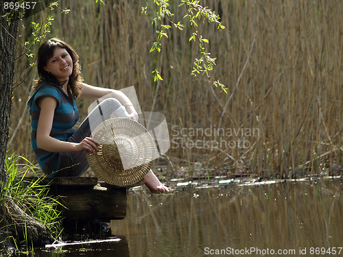 Image of Girl resting near lake