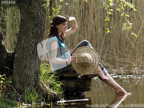 Image of Girl resting near lake