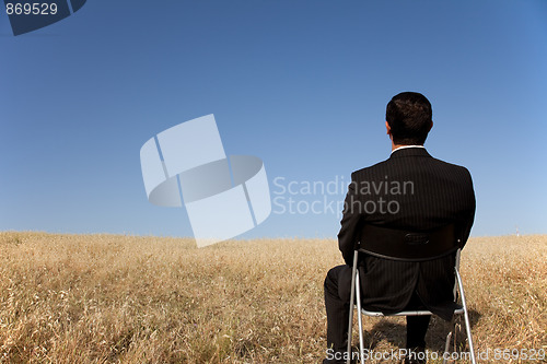 Image of Businessman waiting at the field