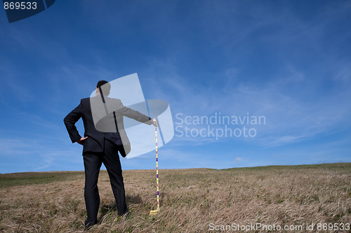 Image of businessman cleaning the environment