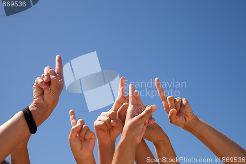 Image of hands raised to the sky