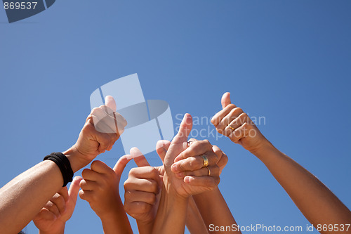 Image of hands raised to the sky