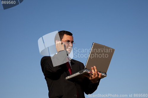 Image of Businessman talking on the cellphone