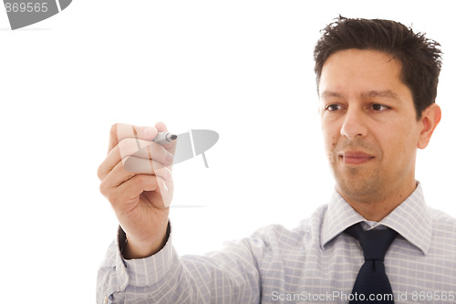 Image of businessman writing at a whiteboard