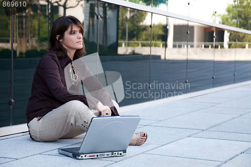 Image of Businesswoman working outdoor