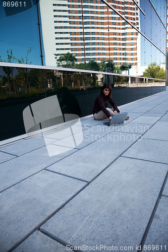 Image of Businesswoman working outdoor