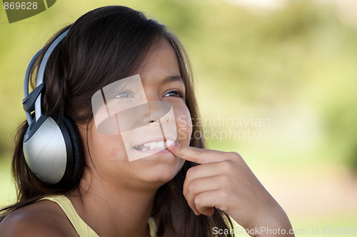 Image of young child listening music
