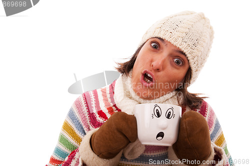 Image of Surprised woman like her hot drink cup