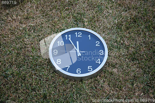 Image of Wall clock in the grass