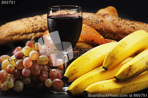 Image of Red wine with fruits and pastry