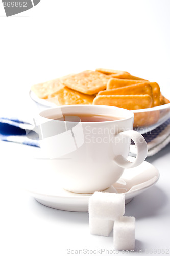 Image of cup of tea, sugar and cookies