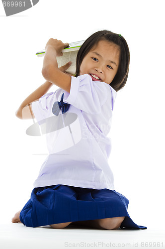 Image of cute girl throwing a book