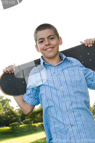 Image of Teenager with His Skateboard